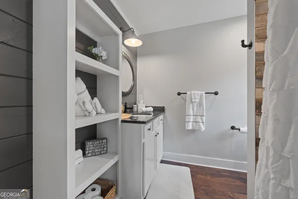 a front view of a house with yard and green space