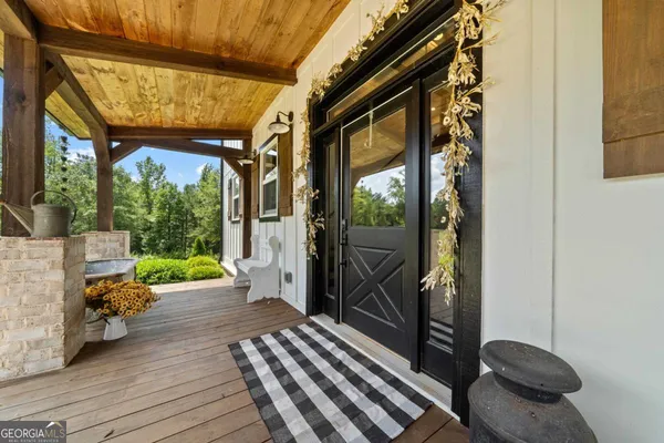 a view of entryway with wooden floor and door