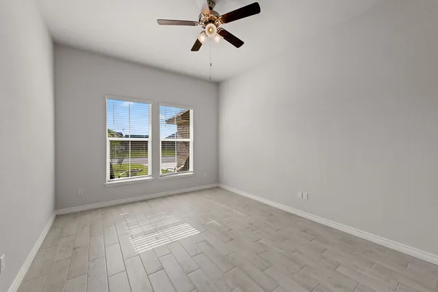 a kitchen with stainless steel appliances kitchen island granite countertop a refrigerator and microwave