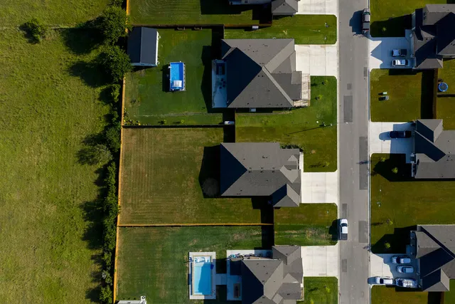 an aerial view of a house having yard