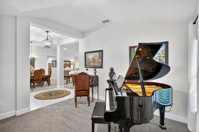 a view of a dining room with furniture window and outside view