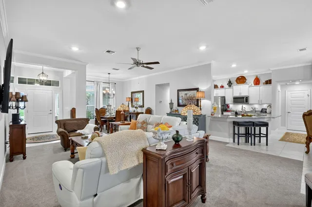 a kitchen with stainless steel appliances kitchen island granite countertop a sink and cabinets