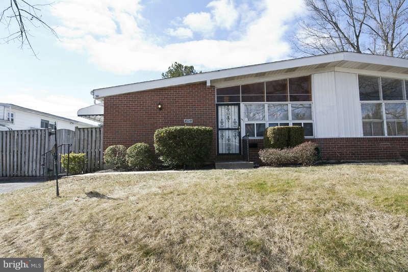 8119 Scotts Level Road Baltimore, MD 21208 - Photo 1 of 24 a front view of a house with a yard