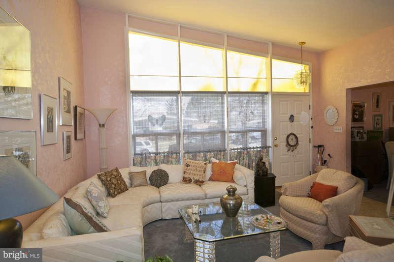 8119 Scotts Level Road Baltimore, MD 21208 - Photo 3 of 24 a living room with furniture and a large window