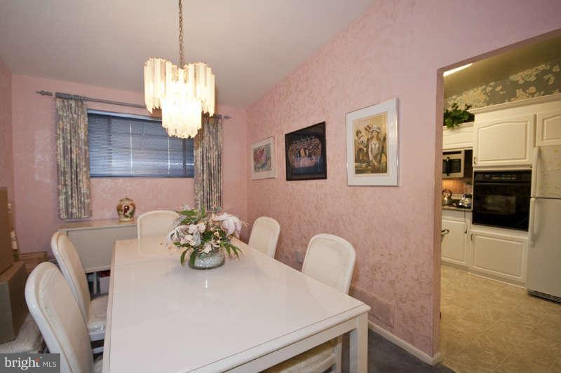 8119 Scotts Level Road Baltimore, MD 21208 - Photo 6 of 24 a view of kitchen with furniture and chandelier