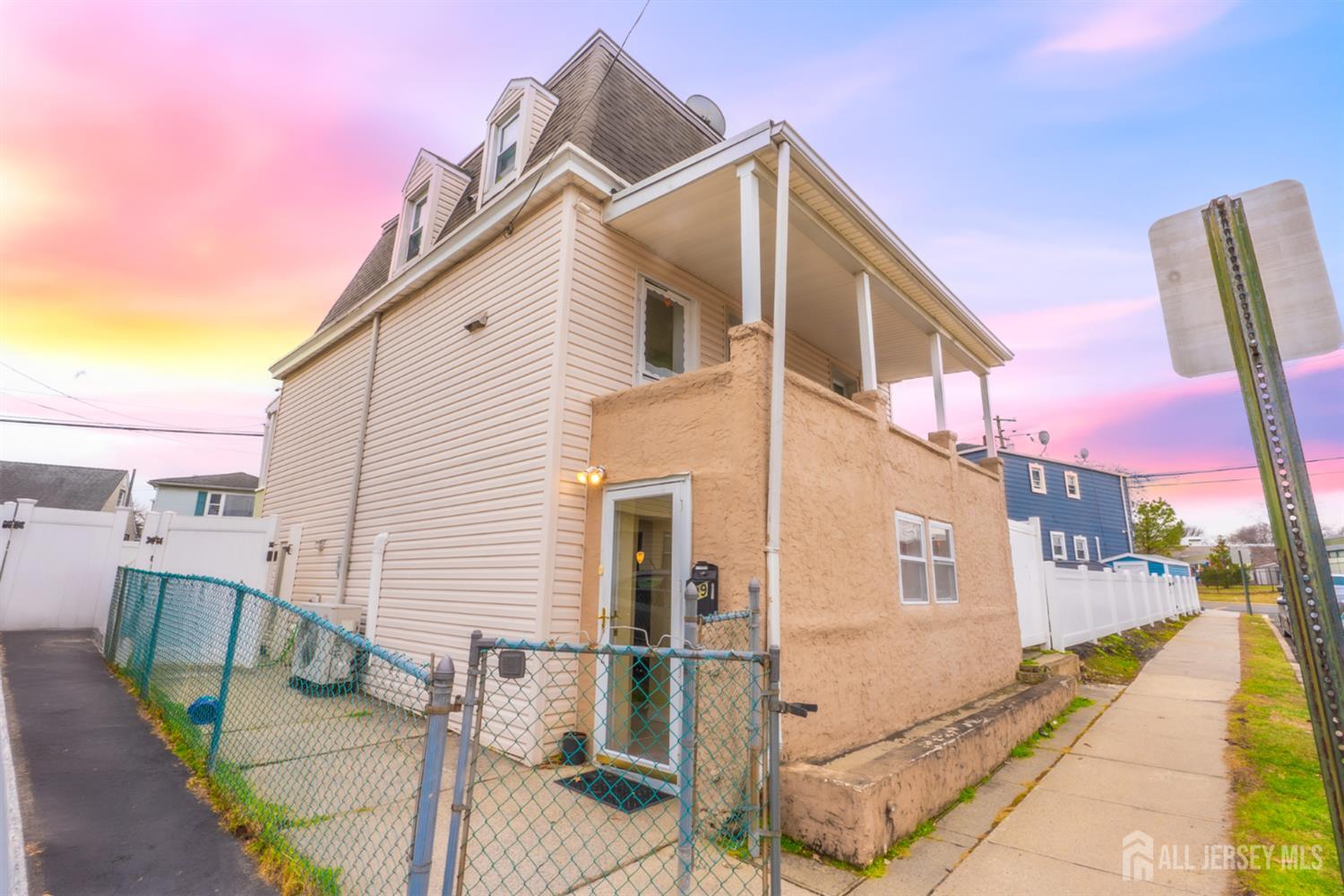 439 Ashley Street Perth Amboy, NJ 08861 - Photo 1 of 17 a view of a house with a backyard