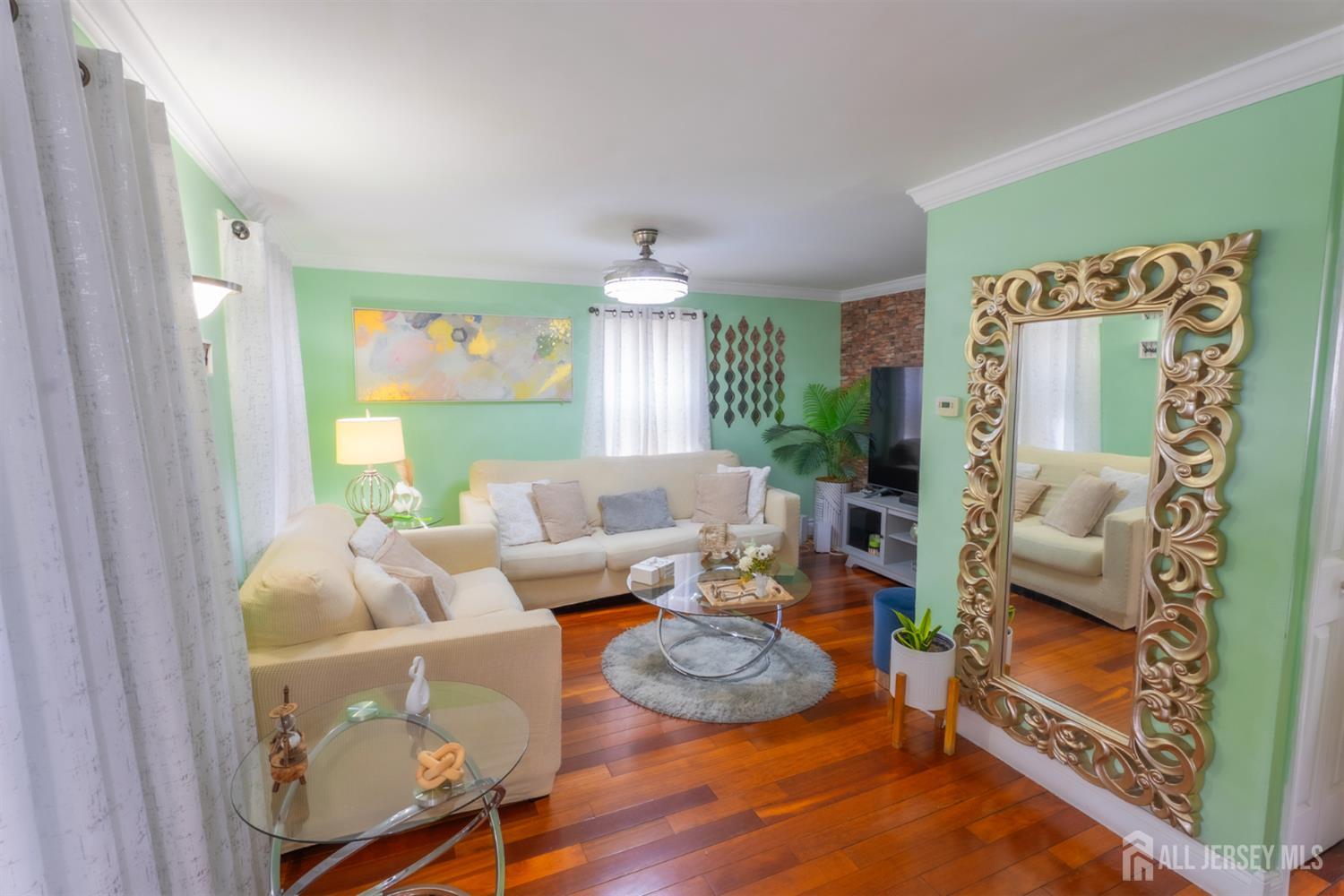 439 Ashley Street Perth Amboy, NJ 08861 - Photo 12 of 17 a living room with furniture and a large window
