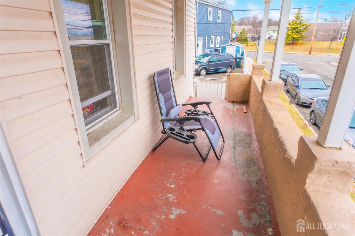 439 Ashley Street Perth Amboy, NJ 08861 - Photo 13 of 17 a dining room with furniture and a floor to ceiling window