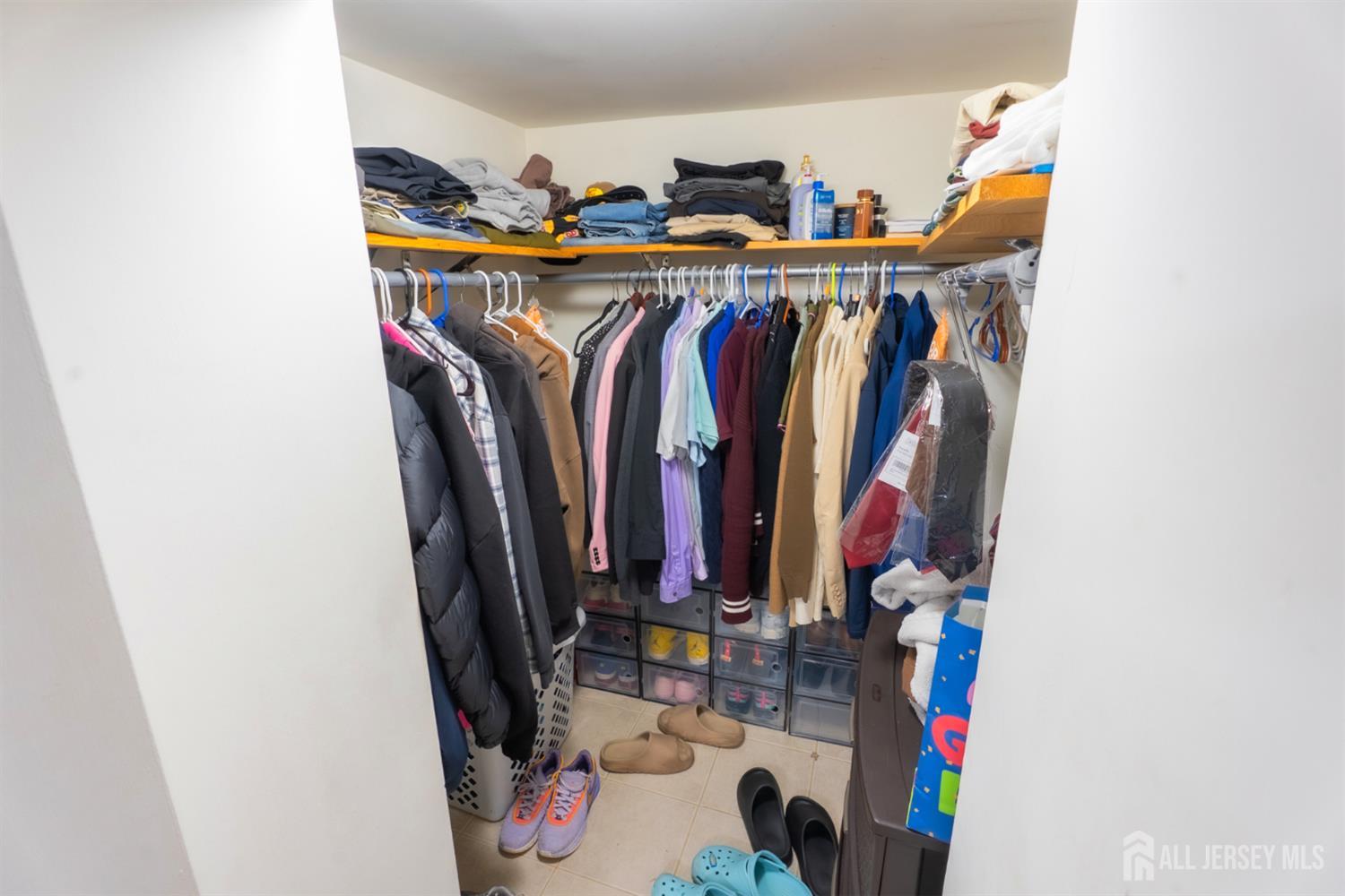 439 Ashley Street Perth Amboy, NJ 08861 - Photo 5 of 17 a view of walk in closet with clothes