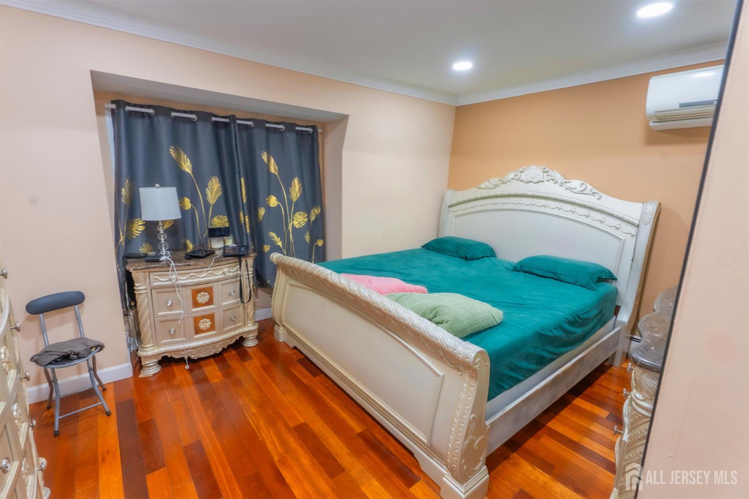 439 Ashley Street Perth Amboy, NJ 08861 - Photo 6 of 17 a bed room with a bed and a window