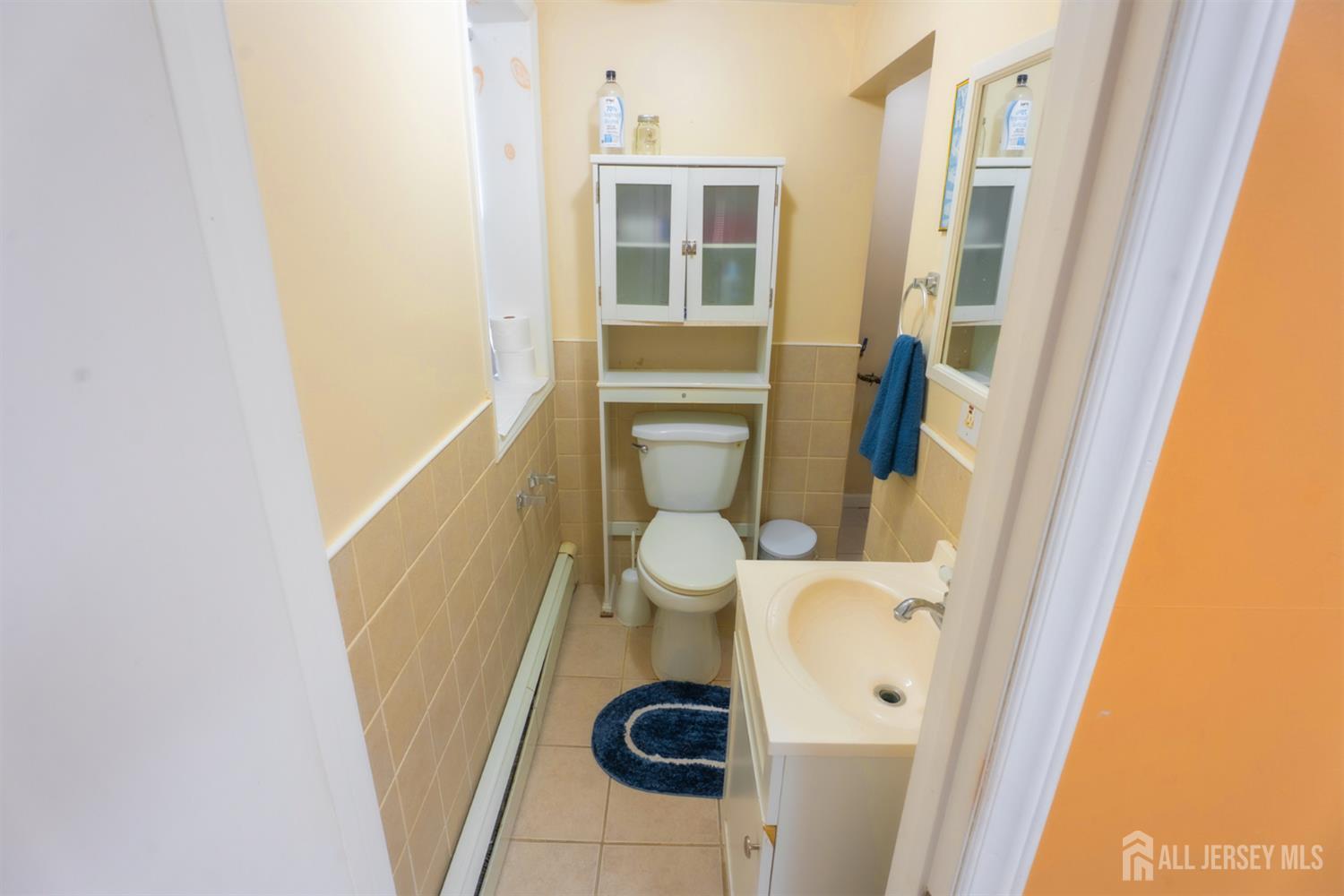 439 Ashley Street Perth Amboy, NJ 08861 - Photo 9 of 17 a bathroom with a sink and toilet