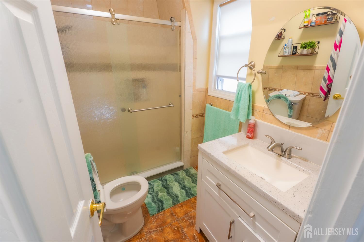 439 Ashley Street Perth Amboy, NJ 08861 - Photo 10 of 17 a bathroom with a sink and toilet