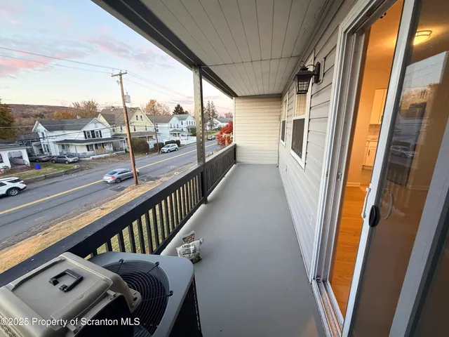 a view of a porch with furniture