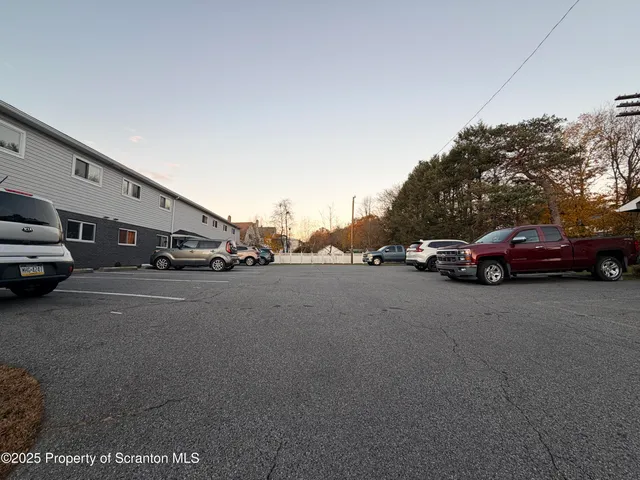 a view of street with parked cars
