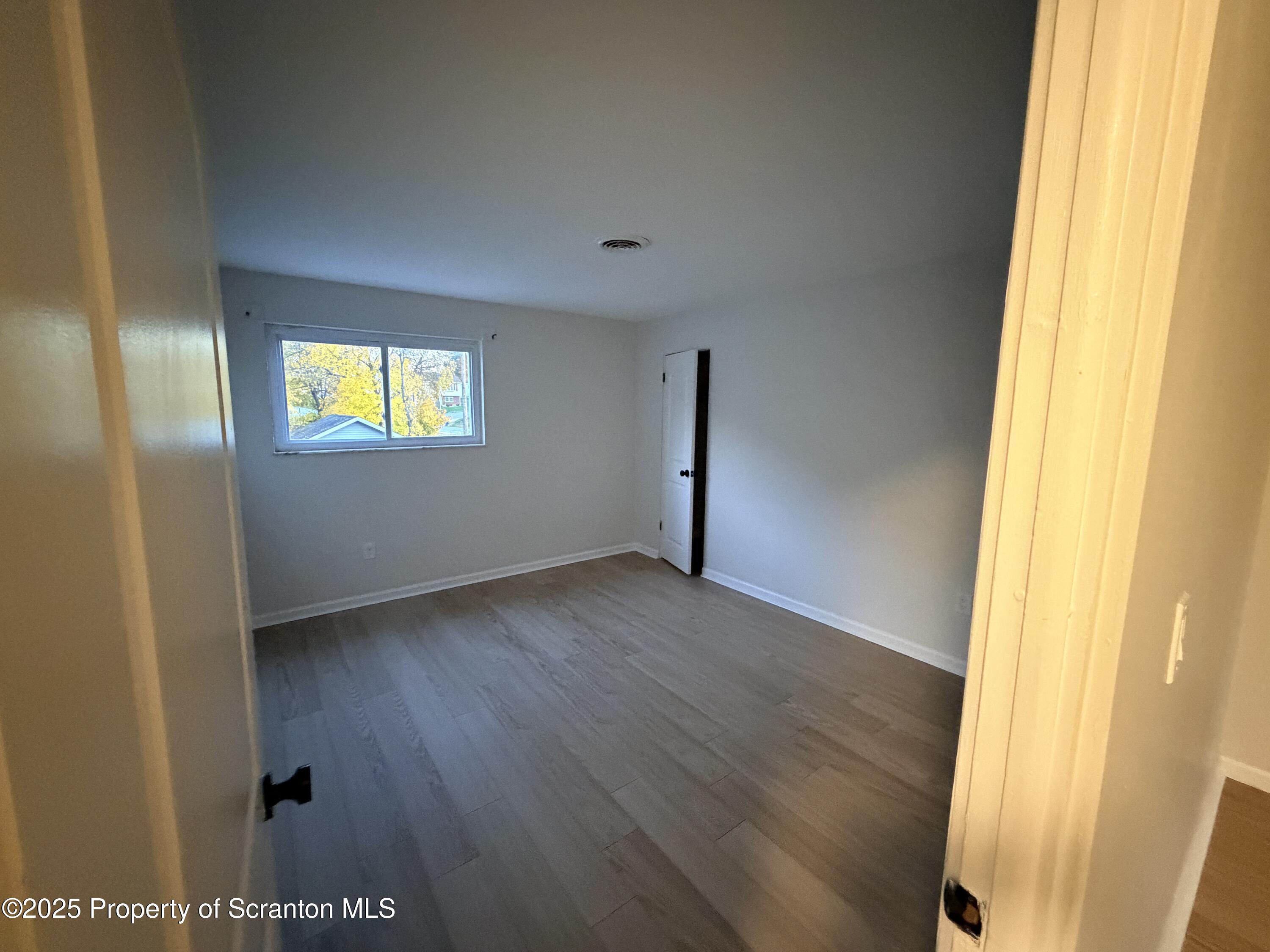 802 Main Street, Unit 3 Duryea, PA 18642 - Photo 5 of 12 a view of an empty room with a window