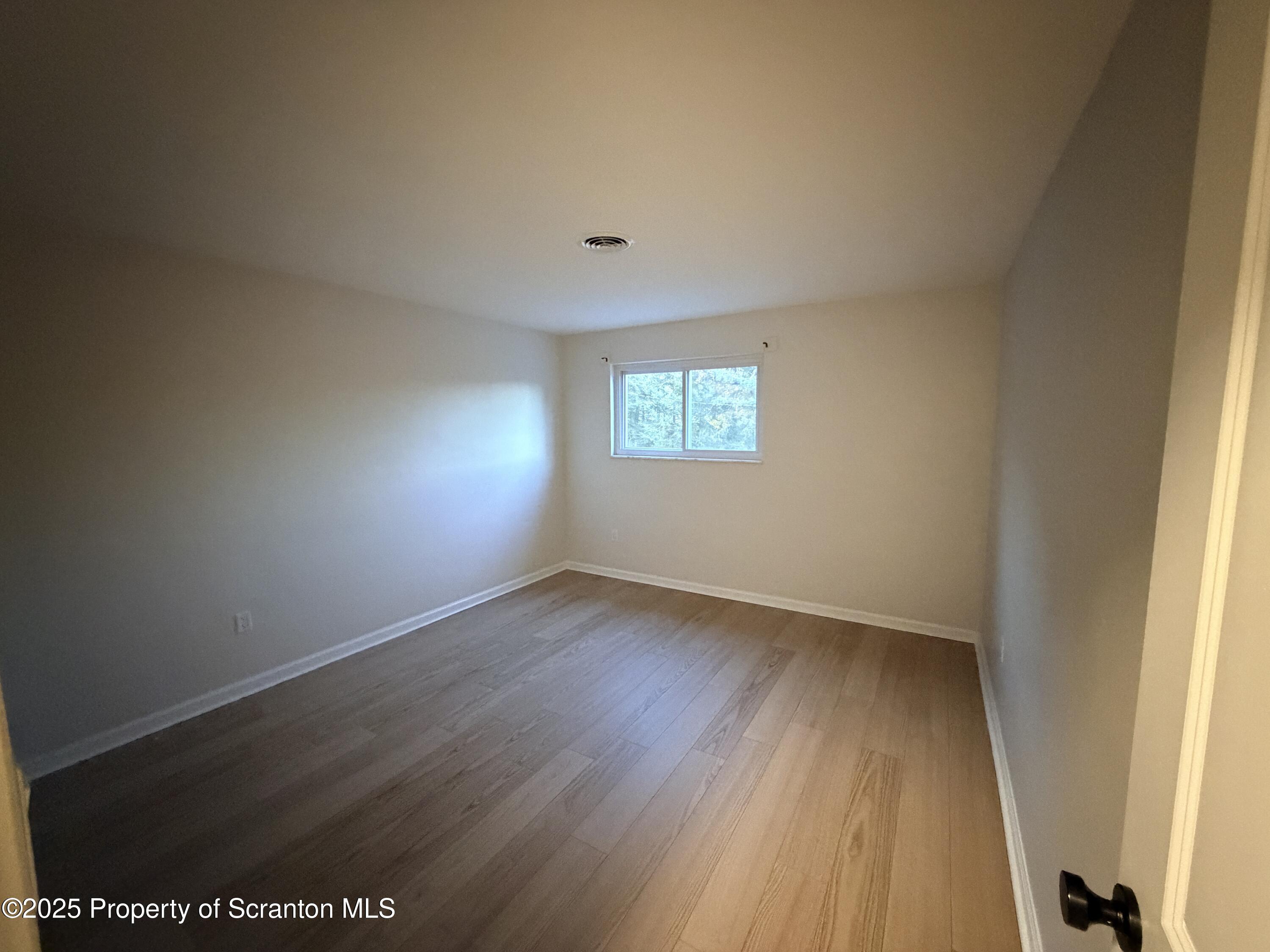 802 Main Street, Unit 3 Duryea, PA 18642 - Photo 7 of 12 a view of an empty room and window