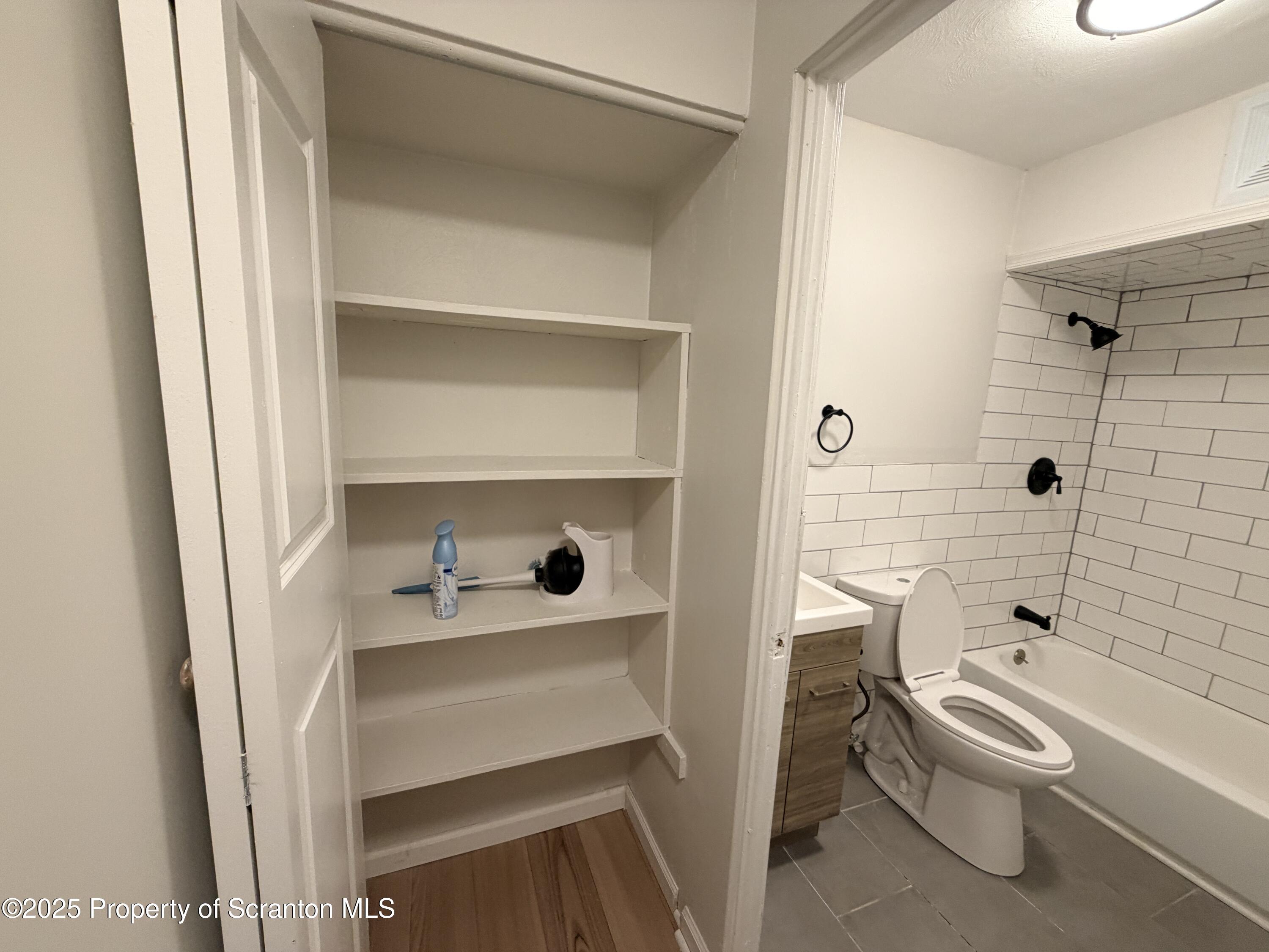 802 Main Street, Unit 3 Duryea, PA 18642 - Photo 10 of 12 a bathroom with a sink a toilet and shower