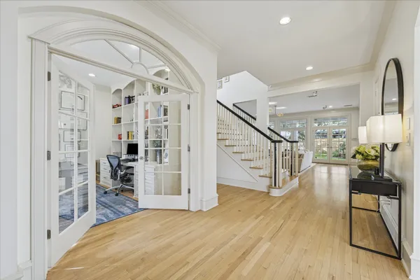 a view of a livingroom with furniture and hardwood floor