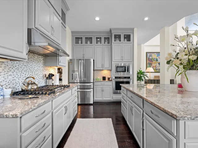a utility room with sink dryer and washer