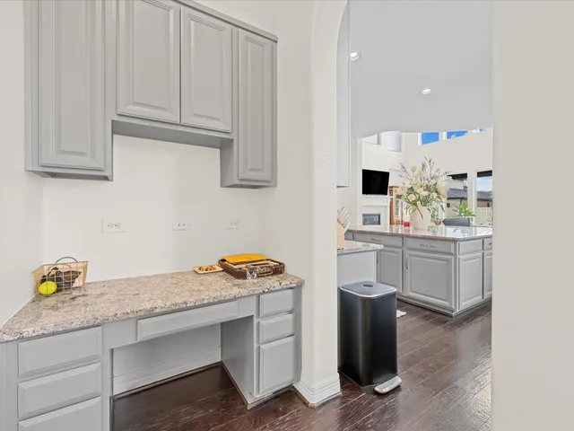 a view of walk in closet with clothes