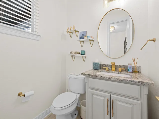 a bedroom with a bed and ceiling fan