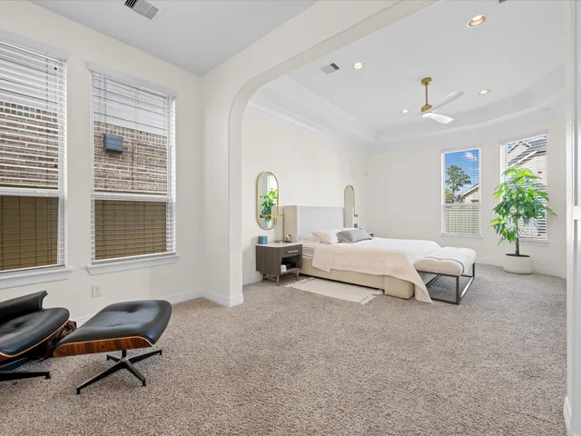 a bed room with a bed a table and decor