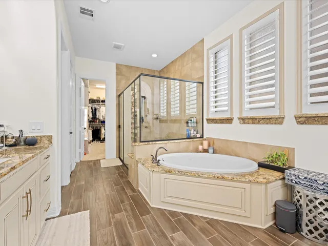 a bedroom with two beds and a window