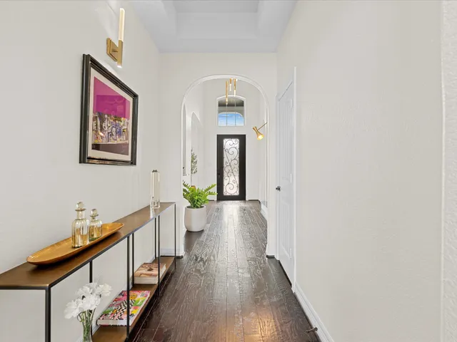 a kitchen with counter space dining table and stainless steel appliances