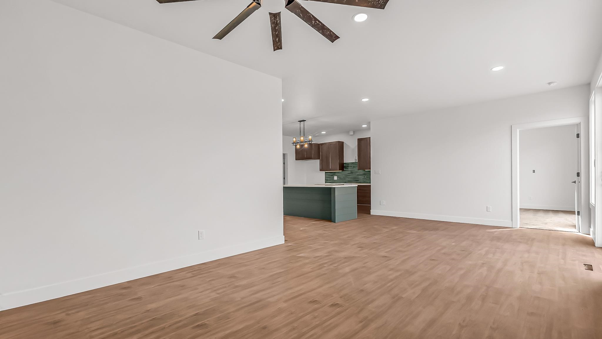 214 Limberpine Circle Parachute, CO 81635 - Photo 8 of 24 a view of a kitchen with a sink and wooden floor