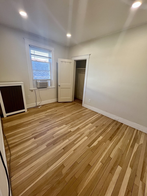 26 Chiswick Road, Unit 13 Boston, MA 02135 - Photo 12 of 19 a view of a livingroom with wooden floor and a flat screen tv