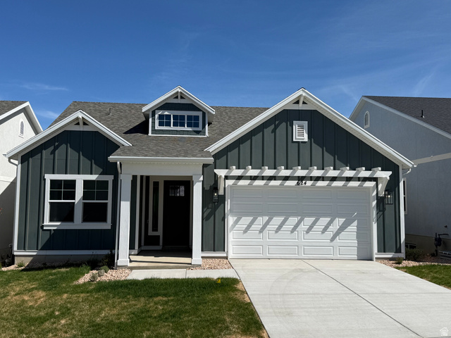 624 North Legend Circle, Unit 480 Mapleton, UT 84664 - Photo 1 of 34 View of front of house featuring board and batten siding, roof with shingles, a garage, and concrete driveway