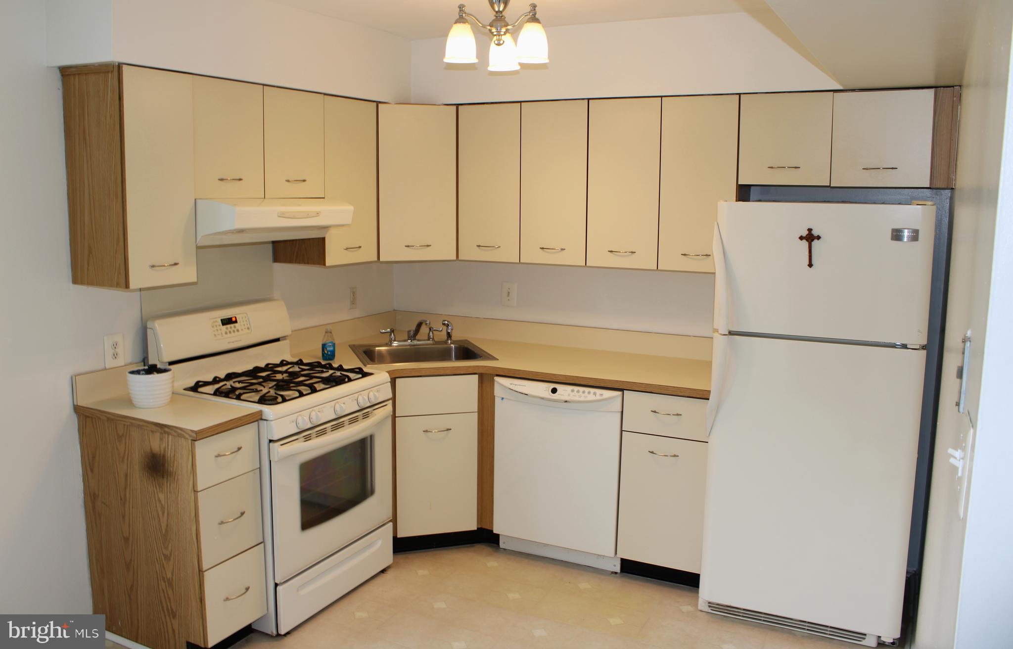 42 Forge Road Medford, NJ 08055 - Photo 4 of 10 a kitchen with white cabinets and white appliances