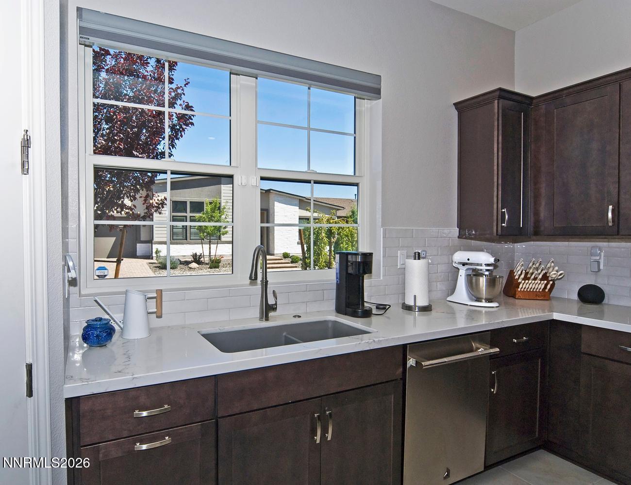2332 Hammer Falls Drive Reno, NV 89521 - Photo 18 of 57 a kitchen with a sink and cabinets