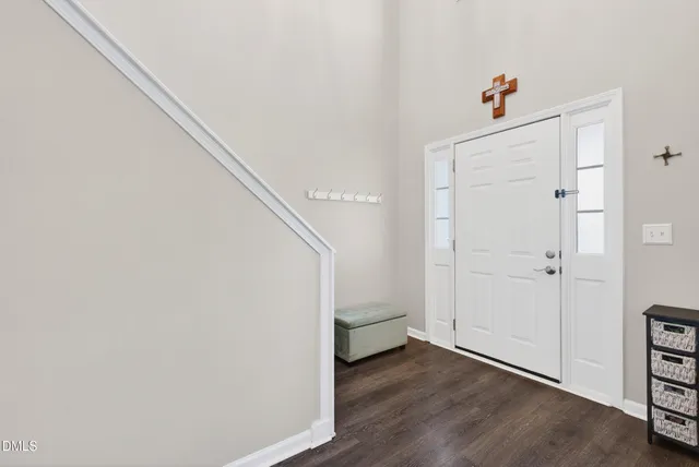 a view of an entryway with wooden floor
