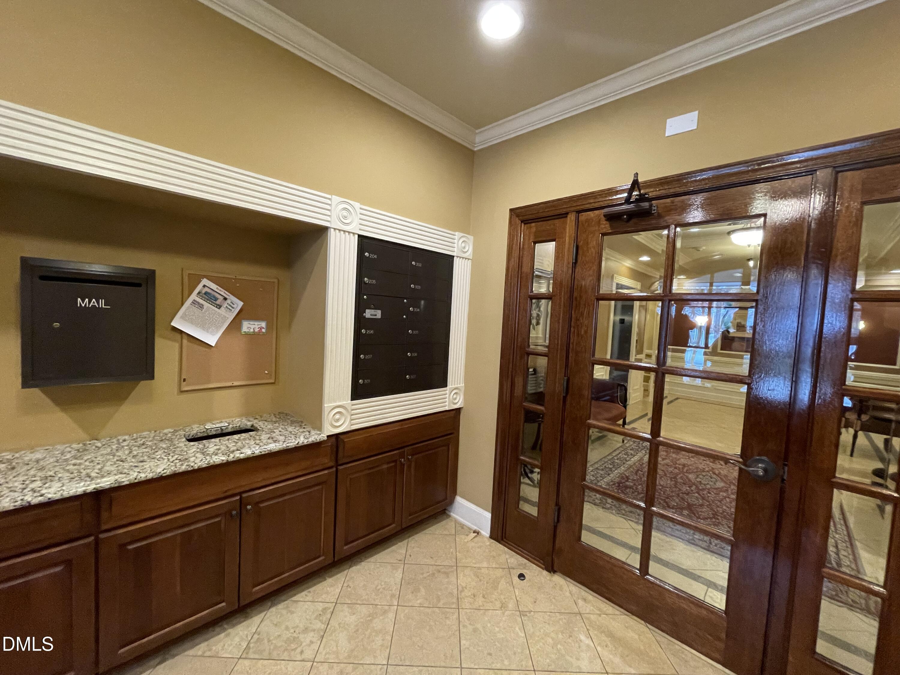 10411 Rosegate Court, Unit 3 Raleigh, NC 27617 - Photo 57 of 62 a bathroom with a granite countertop sink and mirror