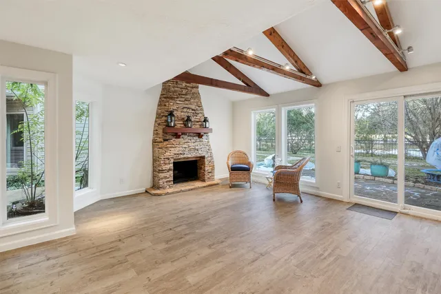 a view of livingroom with furniture fire place and outdoor space