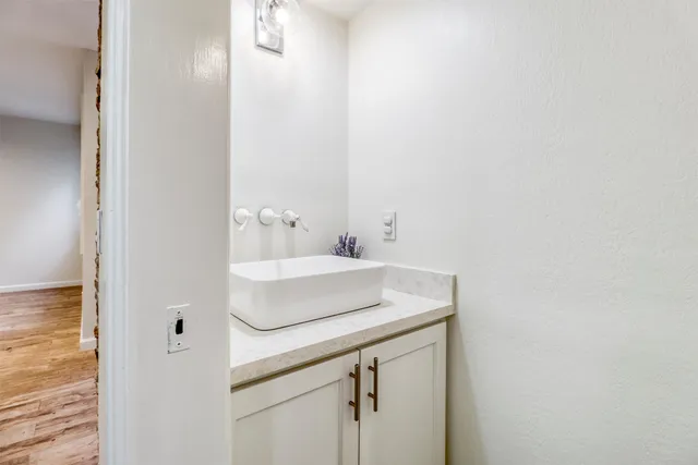 a bathroom with a sink and a mirror