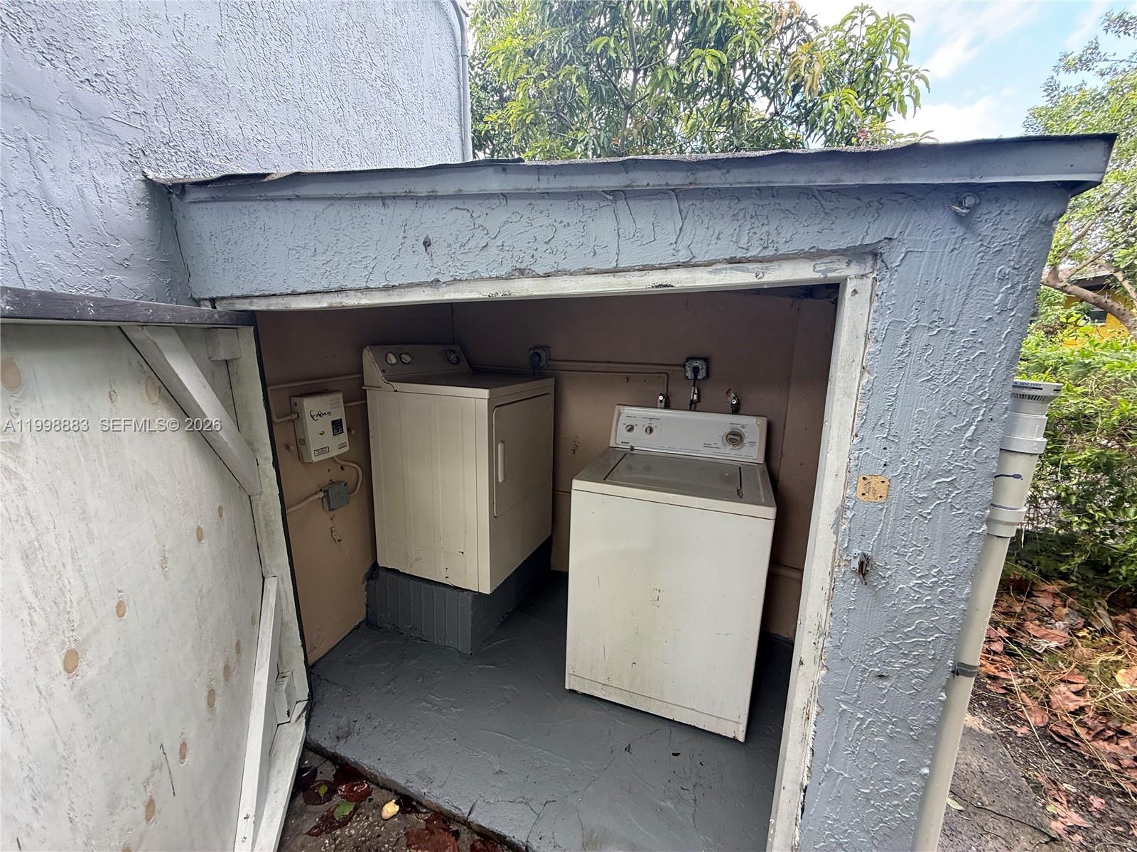 1345 Northwest 55th Street, Unit 2 Miami, FL 33142 - Photo 8 of 9 a utility room with a washer and dryer
