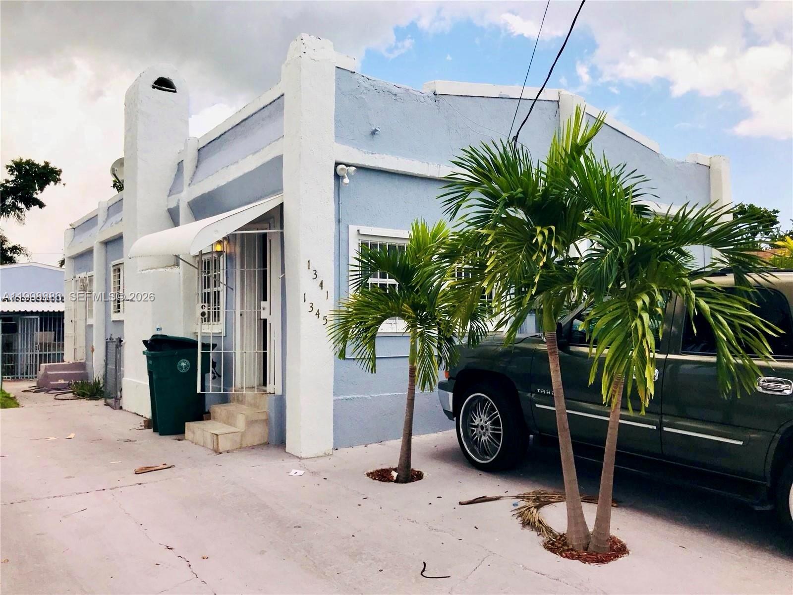 1345 Northwest 55th Street, Unit 2 Miami, FL 33142 - Photo 9 of 9 a car parked in front of a house