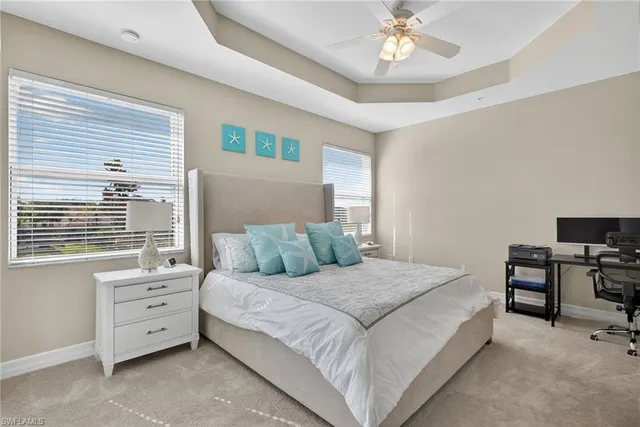 a kitchen with refrigerator and chairs