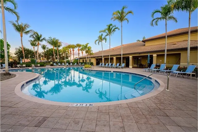 a view of empty room with windows and cabinet