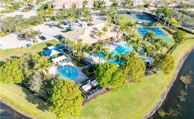a view of a lake with houses in the background