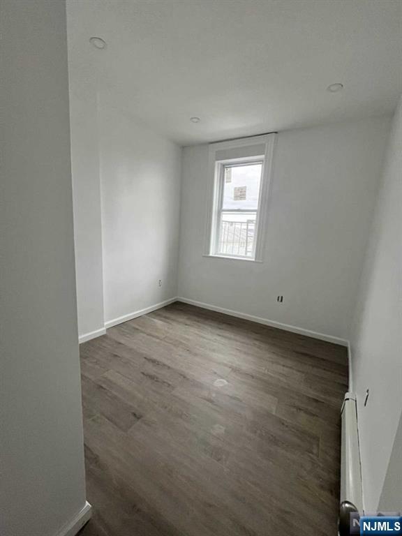 280 MacArthur Avenue, Unit 3 Garfield, NJ 07026 - Photo 9 of 15 an empty room with a window