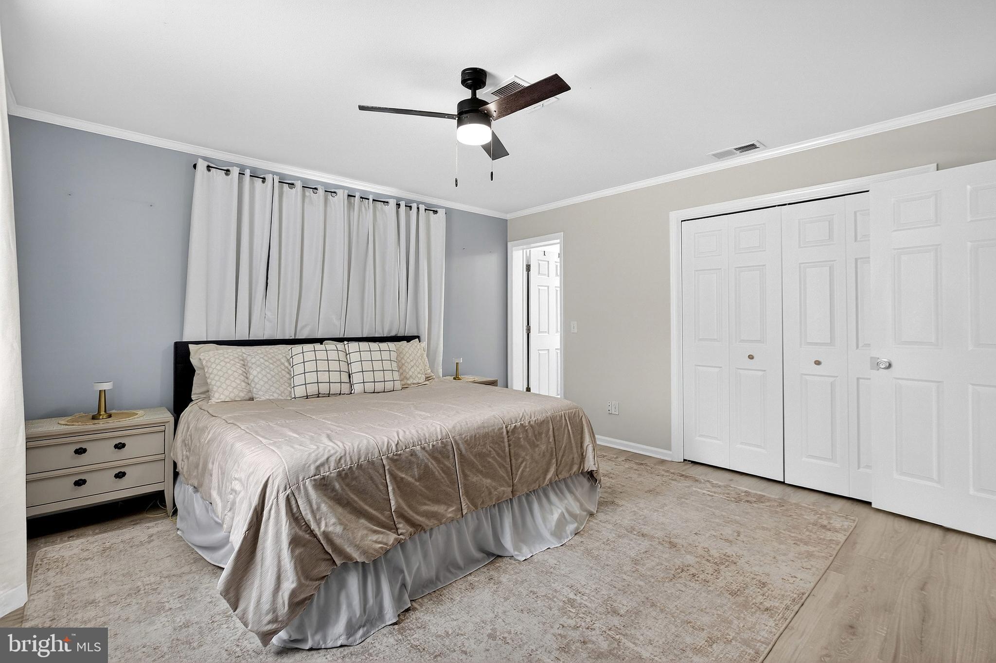 902 Vandyke Greenspring Road Townsend, DE 19734 - Photo 37 of 47 a bedroom with a bed and a ceiling fan