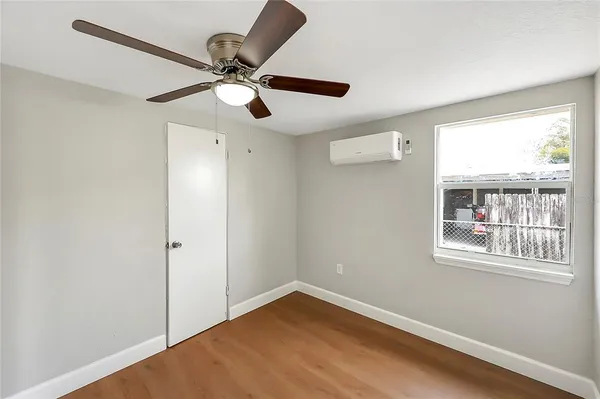 a view of an empty room with a window