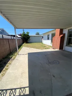 a view of a backyard of the house