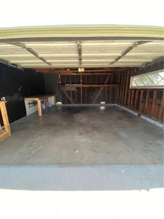 a view of a room with wooden walls