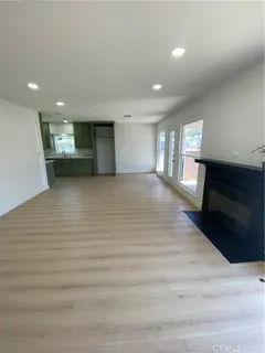 a view of a livingroom and a fireplace