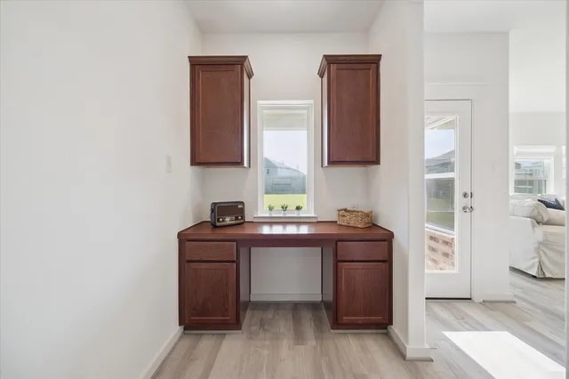 a kitchen with a sink and a stove top oven