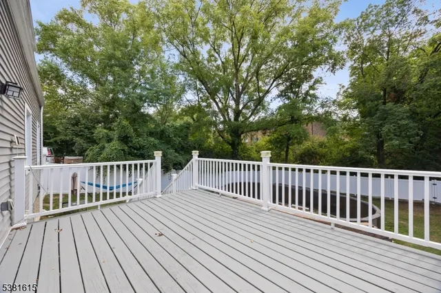 a view of deck with wooden floor and fence